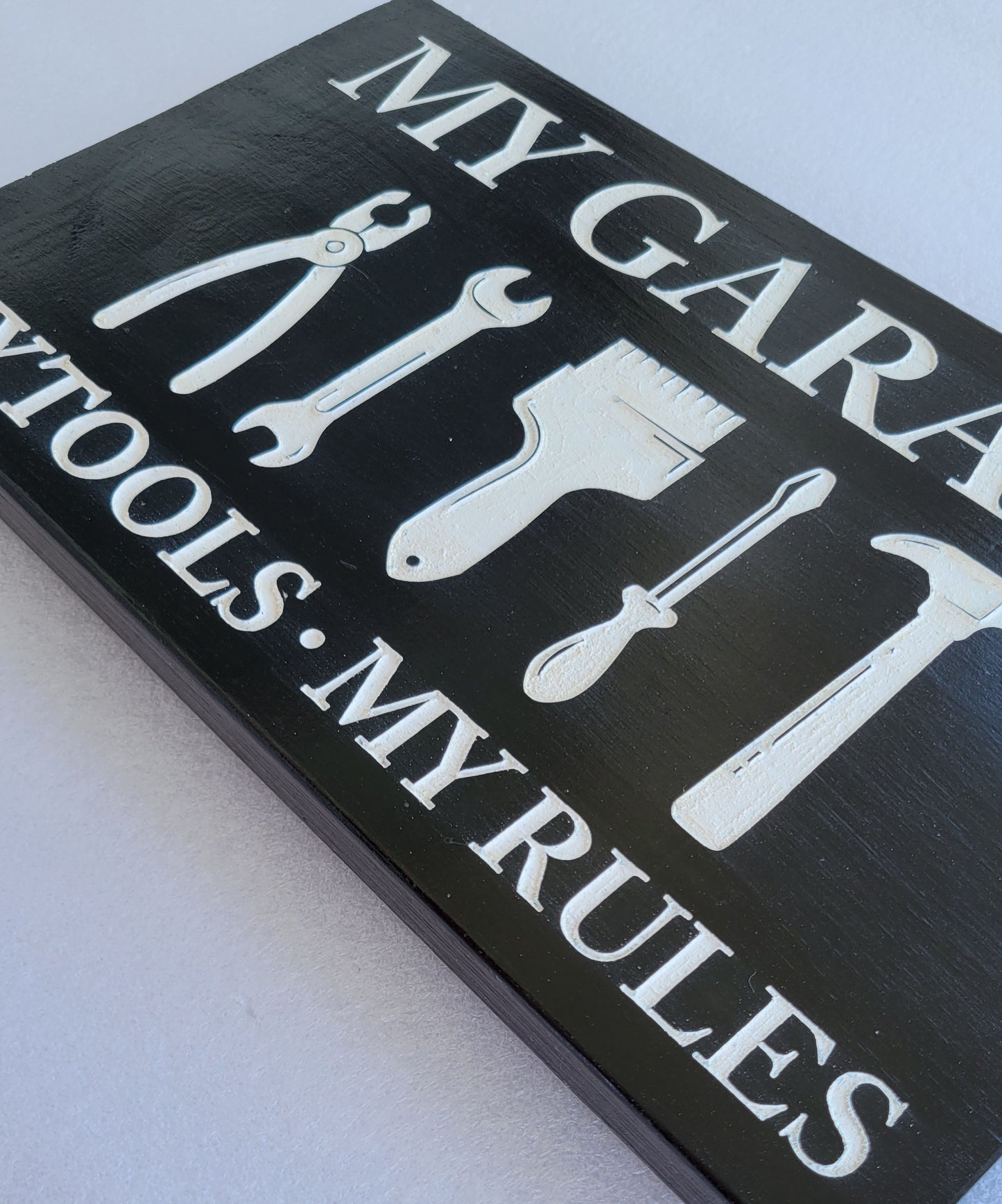 black and white wood handmade my garage my tools my rules sign close up
