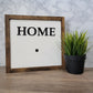 Dark wood framed home sign