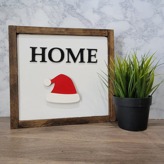 Dark wood framed home sign with santa hat