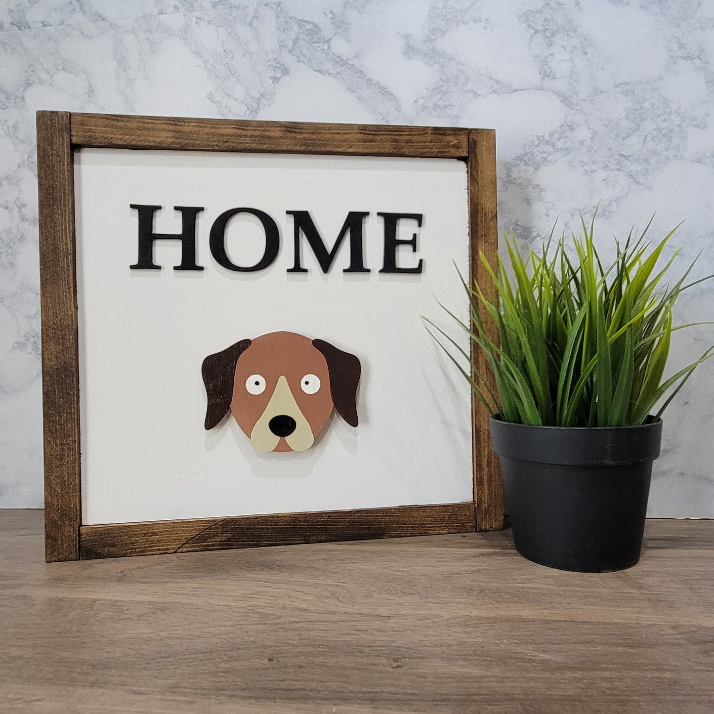 Dark wood framed home sign with dog