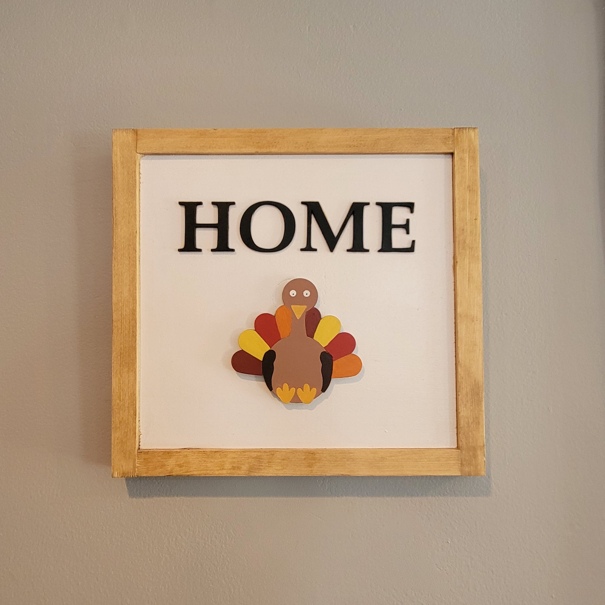 Light wood framed hanging home sign with turkey