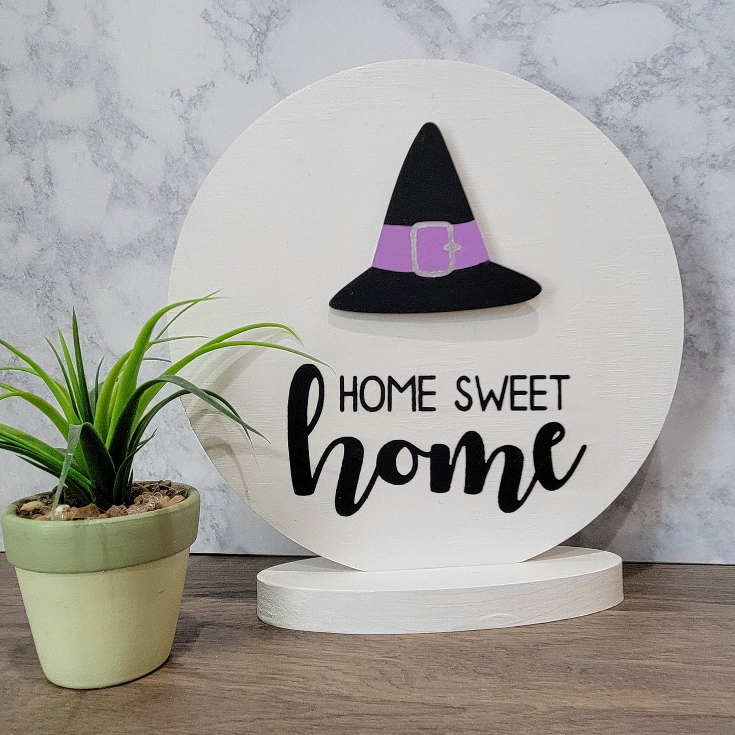 home sweet home white wood round tabletop sign with witch hat