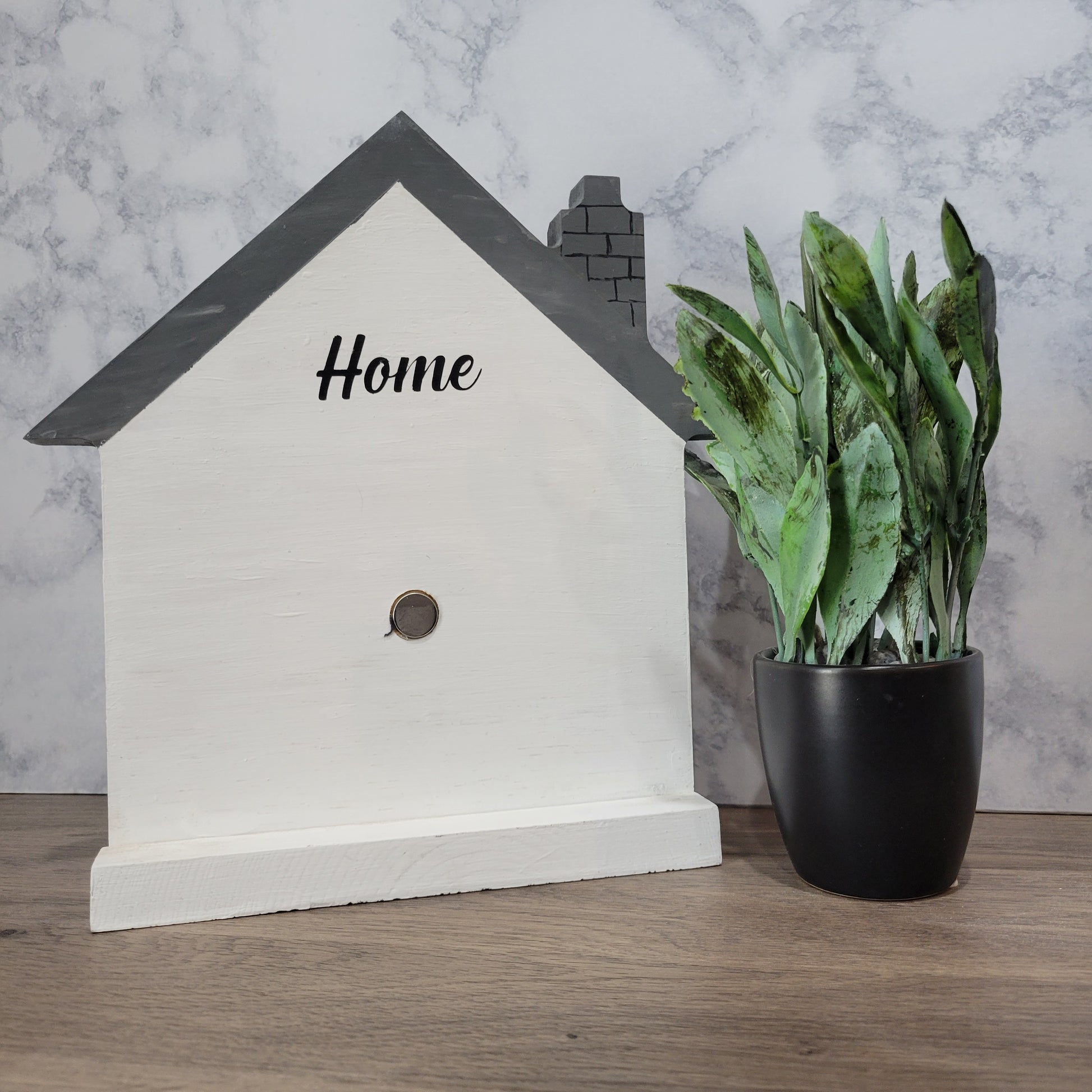 white and grey house shaped wood interchangeable sign with the word home