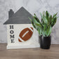 white and grey house shaped wood interchangeable sign with the word home and football