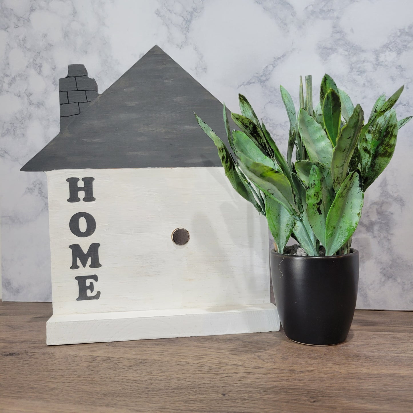 white and grey house shaped wood interchangeable sign with the word home