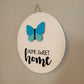 home sweet home white wood round hanging sign with butterfly angle