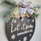 black and white Let it snow somewhere else door hanger with snowflake ribbon and pine tree greenery