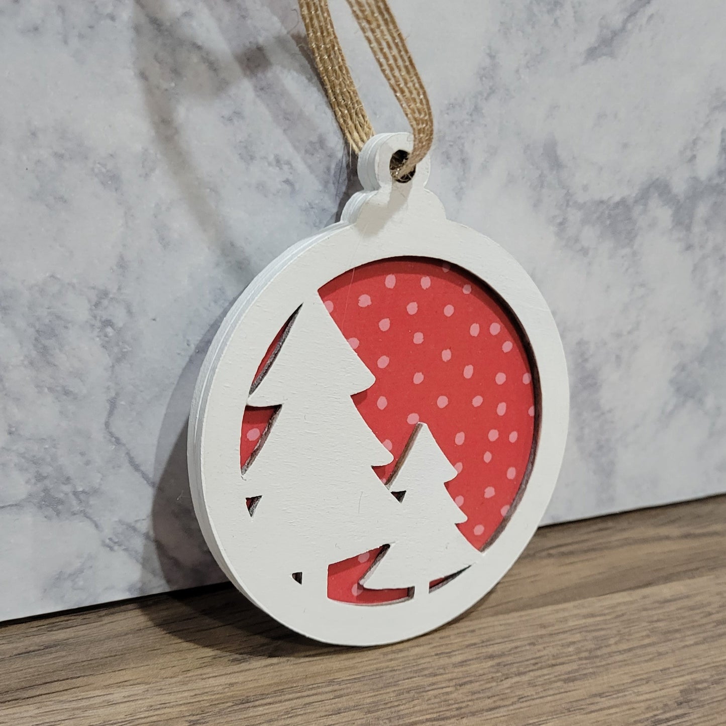 double layer wooden christmas tree with red polka dot background