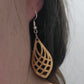 golden oak wooden laser cut teardrop patterned earring on ear