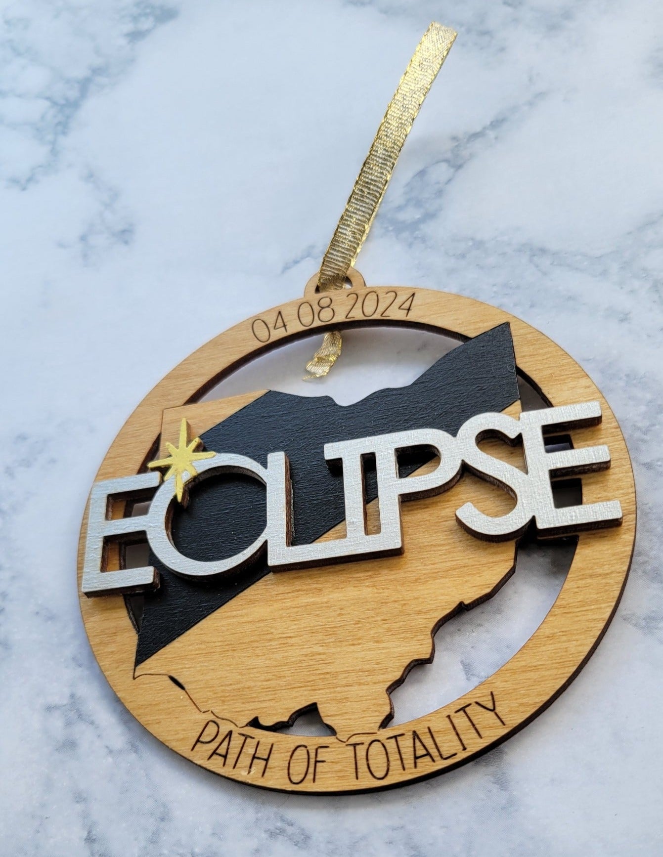 Path of totality eclipse ornament for Christmas angled view