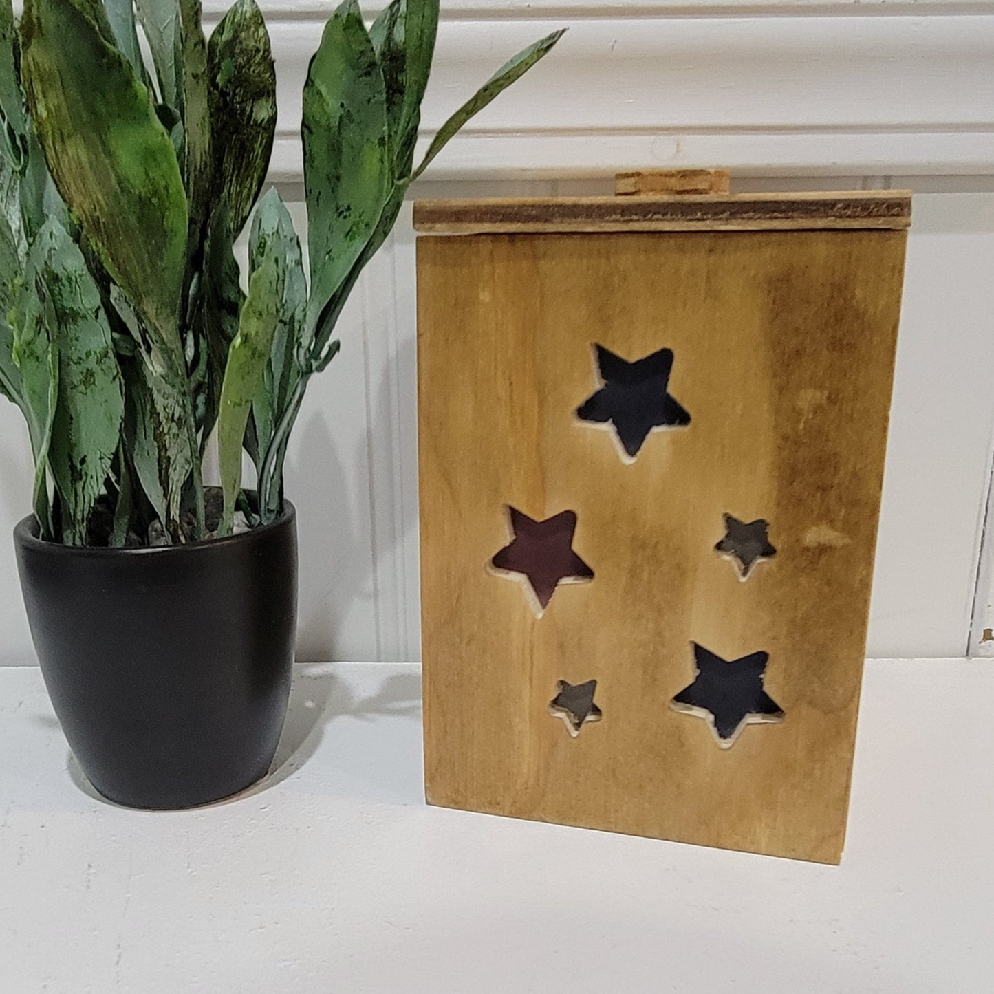 Golden Oak Stars Light Box sitting on table