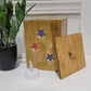 Golden Oak Stars Light Box with lid off and tea light