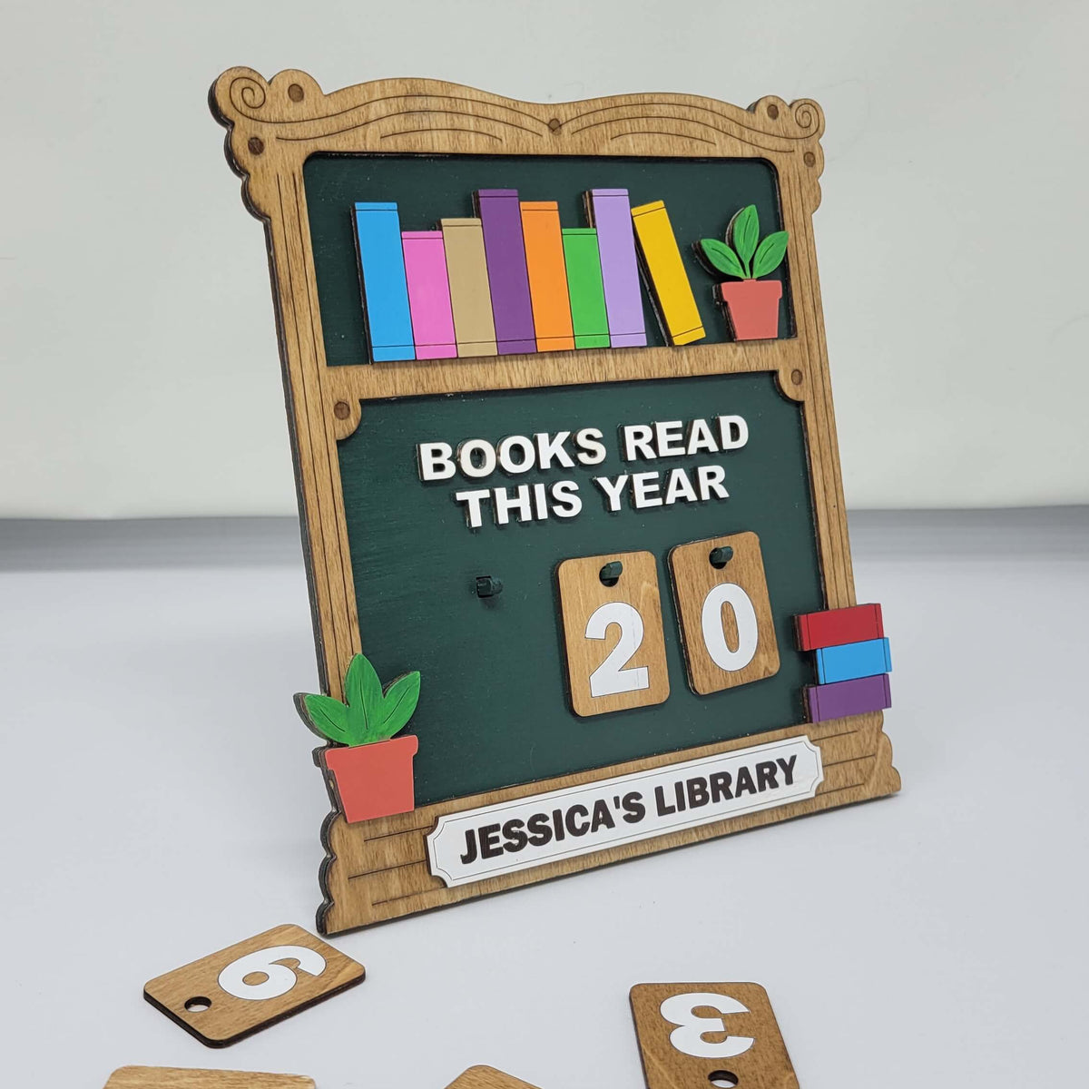 book shelf sign that says books read this year with interchangeable numbers