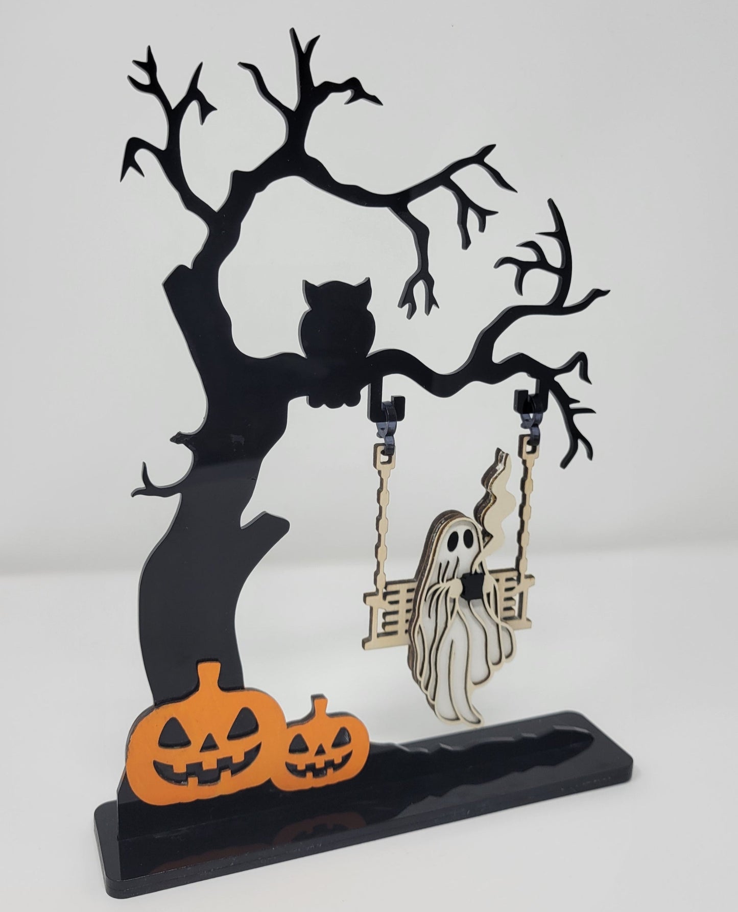 Ghost on a creepy Halloween tree swinging and drinking coffee 1