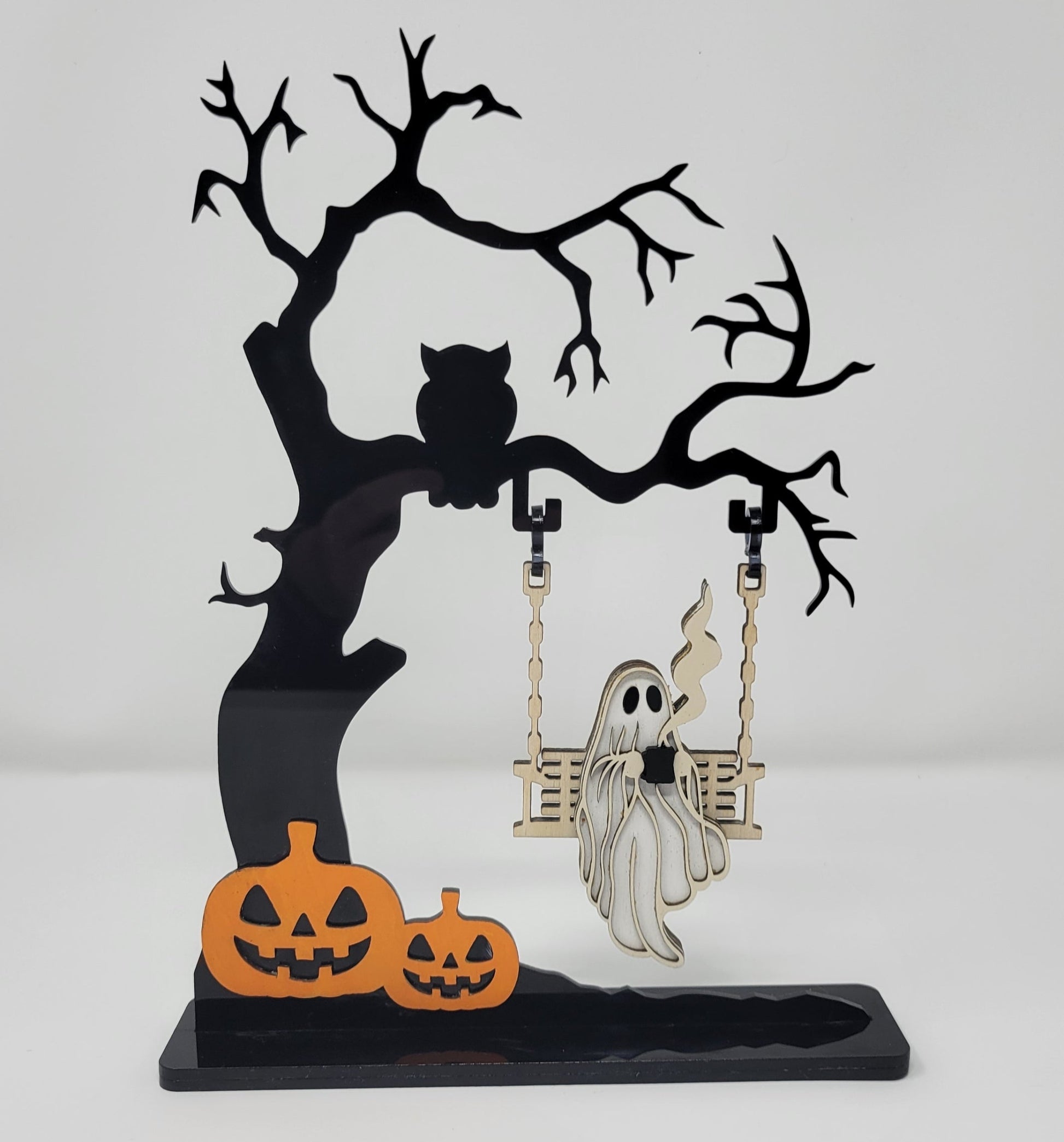 Ghost on a creepy Halloween tree swinging and drinking coffee front view white background