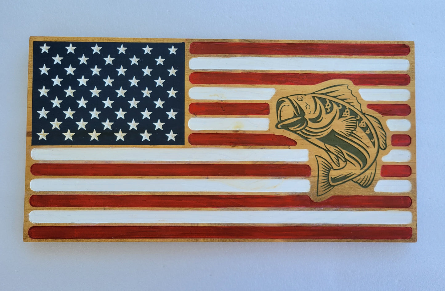 golden oak handmade carved flag with dark green fish sign