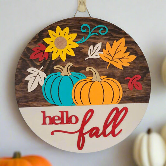Hello Fall Door Hanger Kona Stain and Colorful Autumn Pumpkins and Leaves hanging on a door