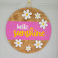 Hello_Sunshine_Daisy_Door_Hanger_hanging on door pink, yellow white and golden oak 1