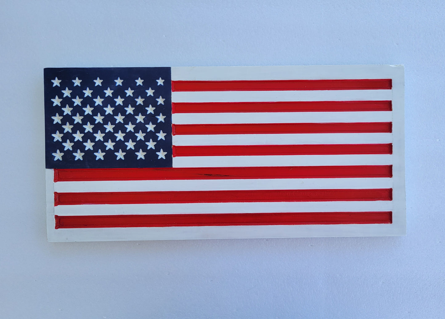 white wooden handmade carved flag sign