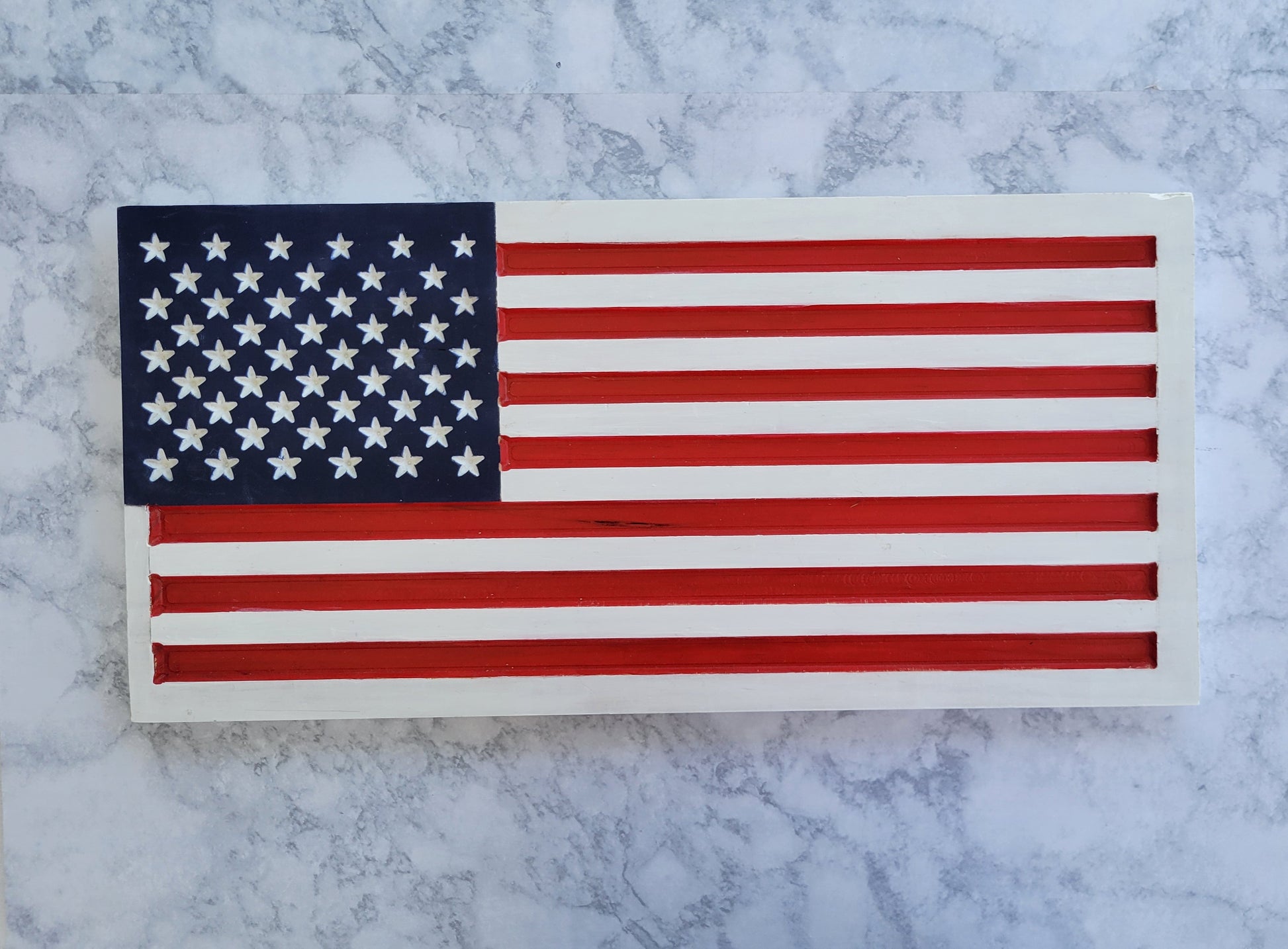 white wooden handmade carved flag sign