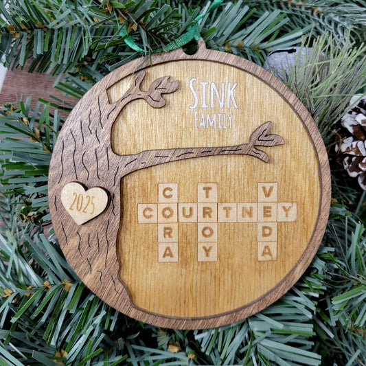 wood round ornament with last name, year and family names