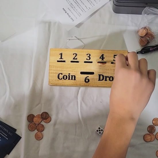 handmade wood coin drop game in play