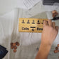 handmade wood coin drop game in play