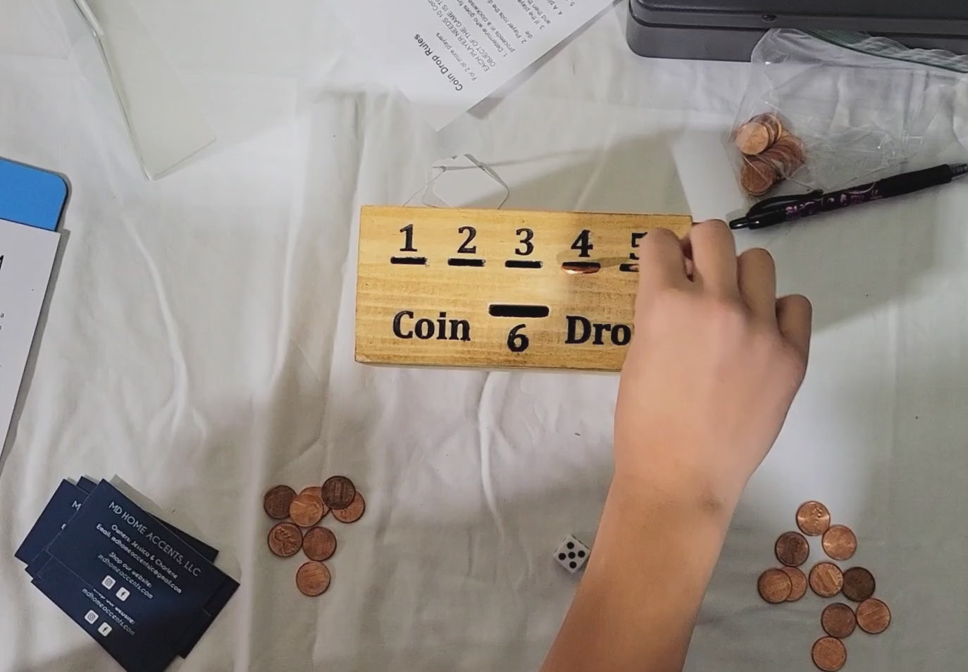 handmade wood coin drop game in play