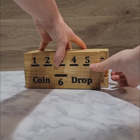 handmade wood coin drop game open and getting coins out