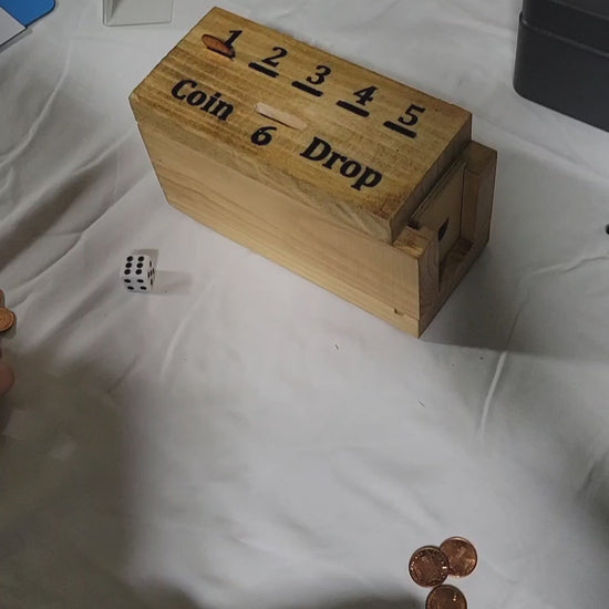 handmade wood coin drop game in play