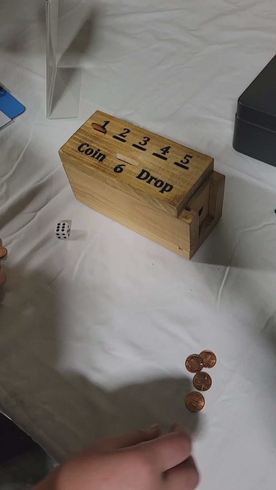 handmade wood coin drop game in play