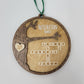 wood round ornament with last name, year and family names on white background hutchison family